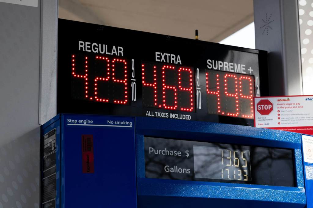 Image of petrol pump showing different prices for higher quality fuel